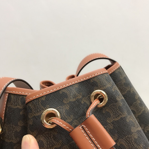 Ce**e medium drawstring bag in triomphe canvas