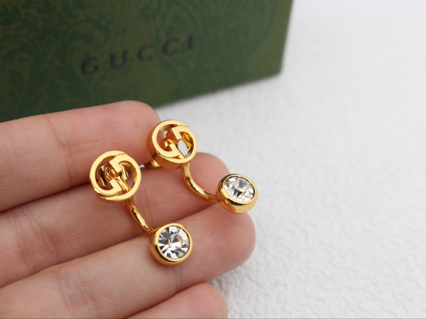 G*u*i earrings